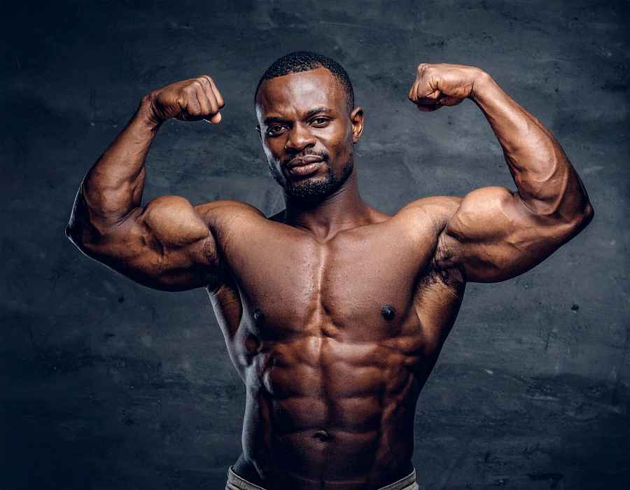 black macho man flexing 
masc-and-dl-gay-label-uk-performed-masculinity