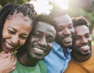 Black queer youth creating visual art during a community workshop in the diaspora.