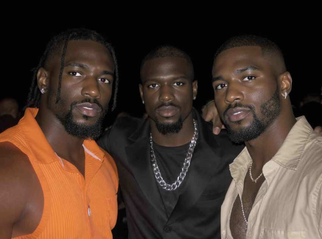 Black queer youth creating visual art during a community workshop.